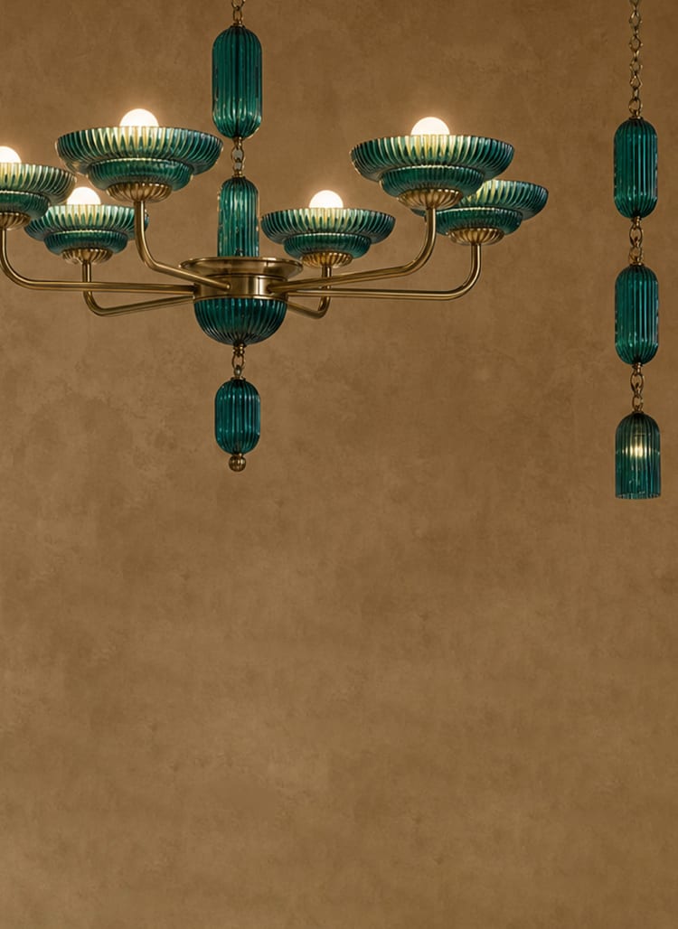 Sculptural green glass lighting with warm brass details